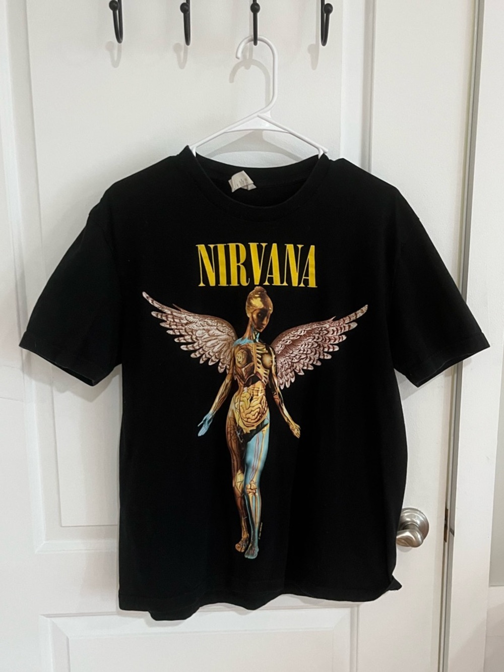 NIRVANA Black Short Sleeve Tee with Yellow Logo and Multicolor Angel Graphic